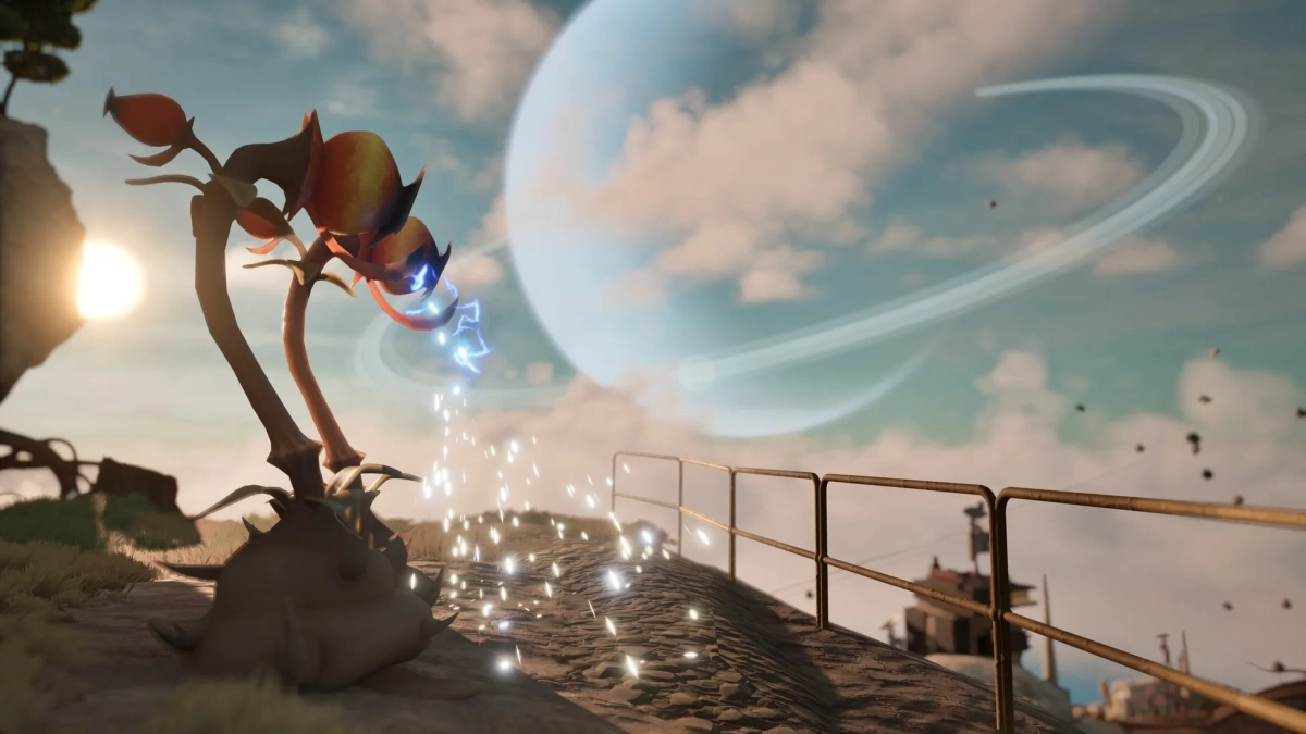 巨大な環を持つ惑星が空に浮かぶ異世界の風景です