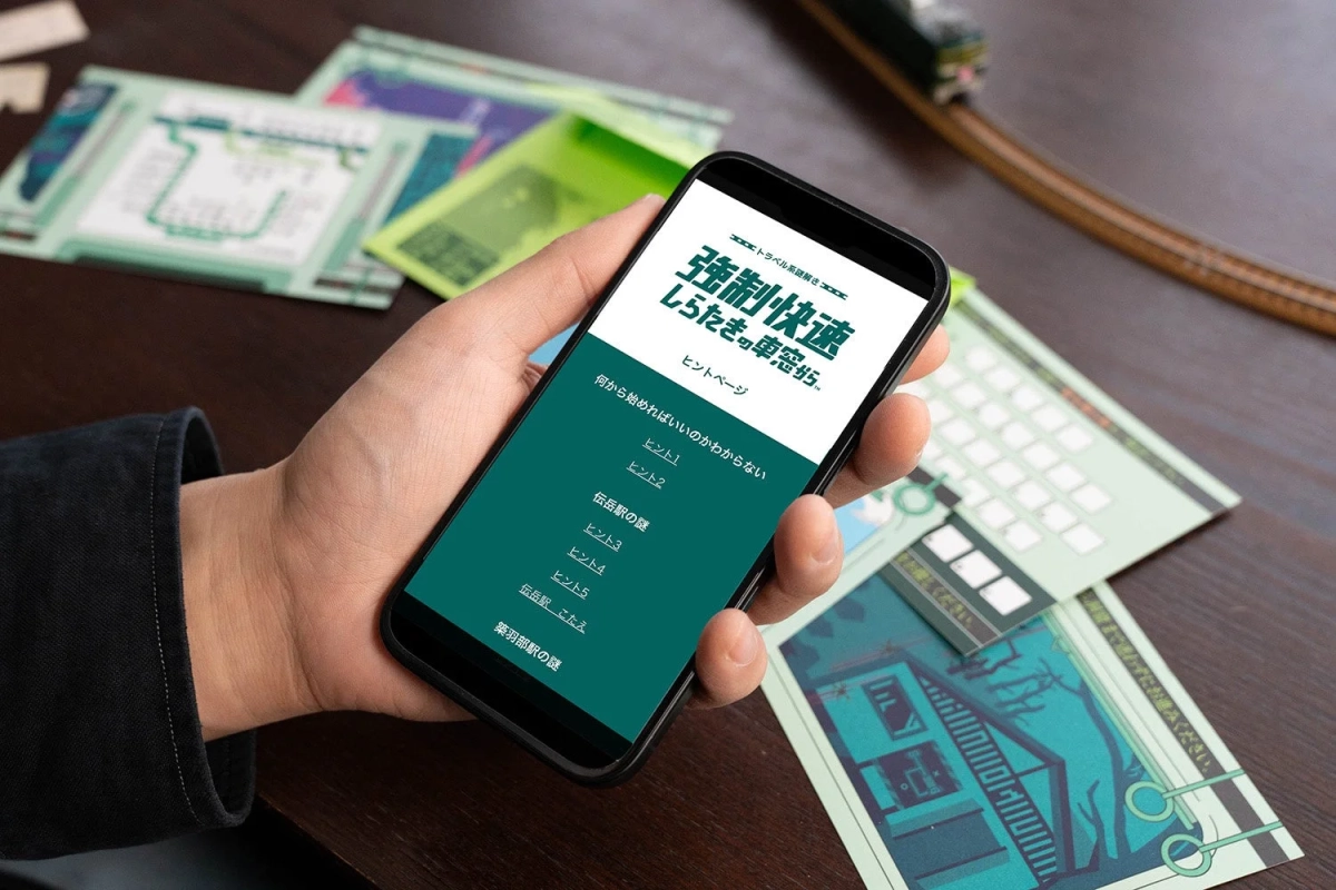 スマートフォンでヒントページを確認する様子