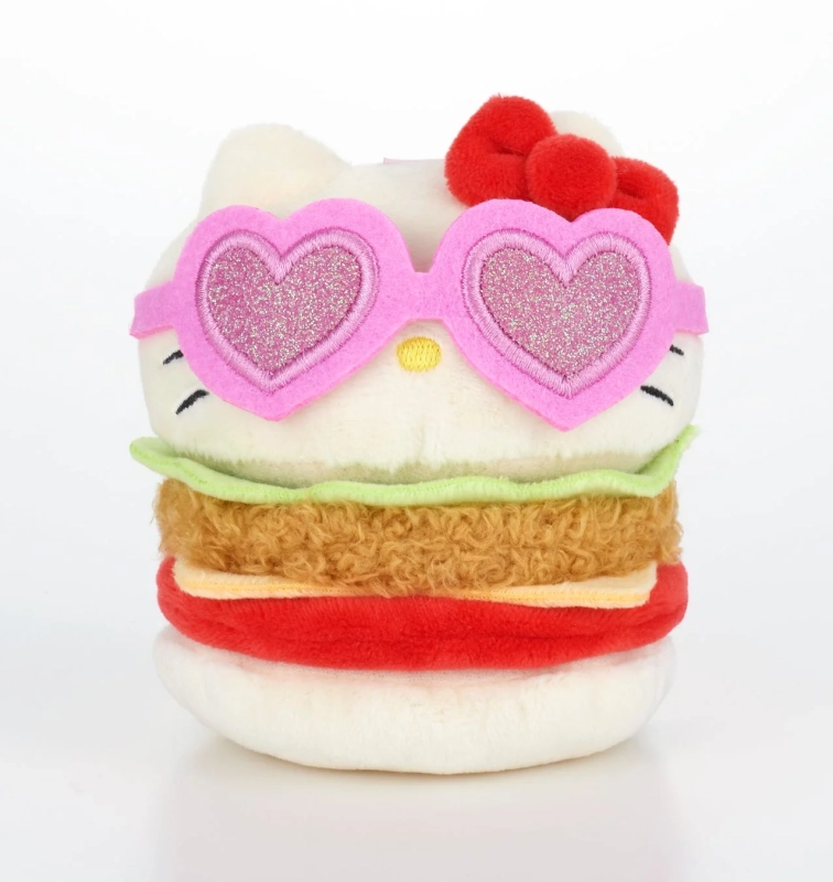 ハローキティがハンバーガーの形をした可愛らしいぬいぐるみで、ピンクのハート型サングラスと赤いリボンを身につけている