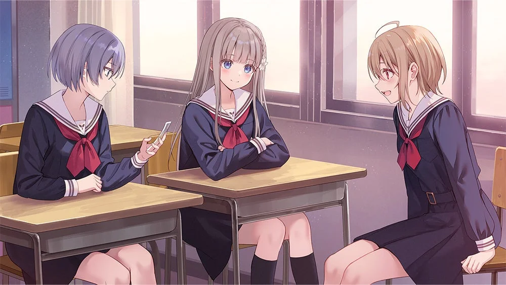 教室で談笑する3人の女子学生