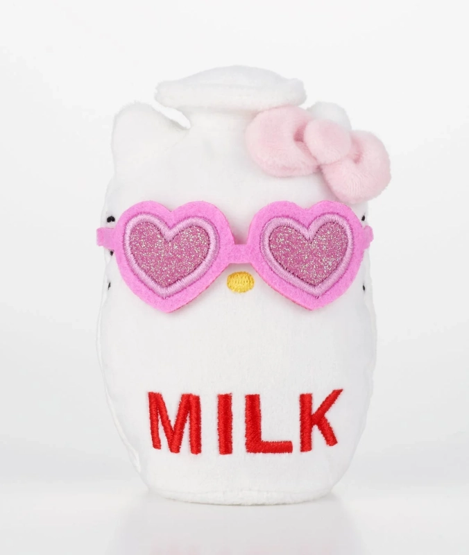 ピンクのハート型サングラスとリボンをつけた白いハローキティのぬいぐるみです。牛乳パックの形をしており、「MILK」と赤い文字で刺繍されています