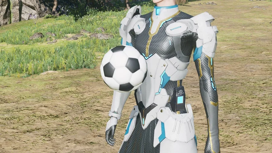 未来的な装甲を身につけたキャラクターが、自然豊かな草原でサッカーボールを抱えている様子が描かれています。